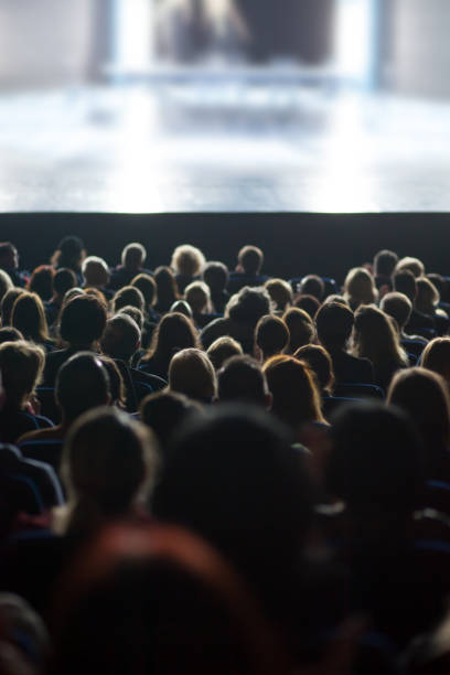 People Watching Movie In Theatre stock photo