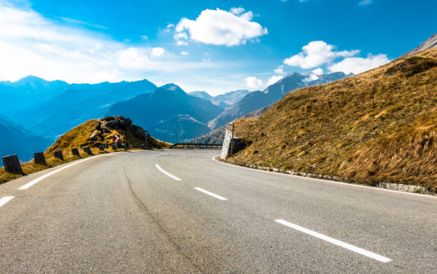 istock country road - european alps 1069730254