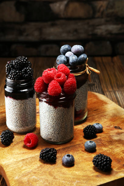 istock Healthy breakfast. chia pudding with kiwi and granola in glass on rustic background. 1069733388