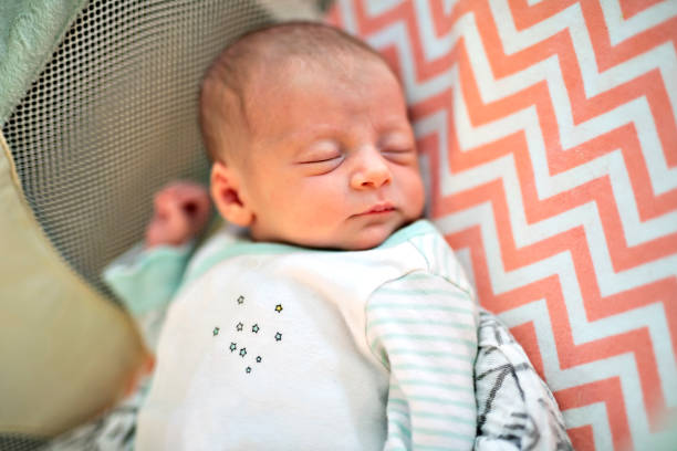 istock A Little Newborn Sleeping on the parent bed 1069733462