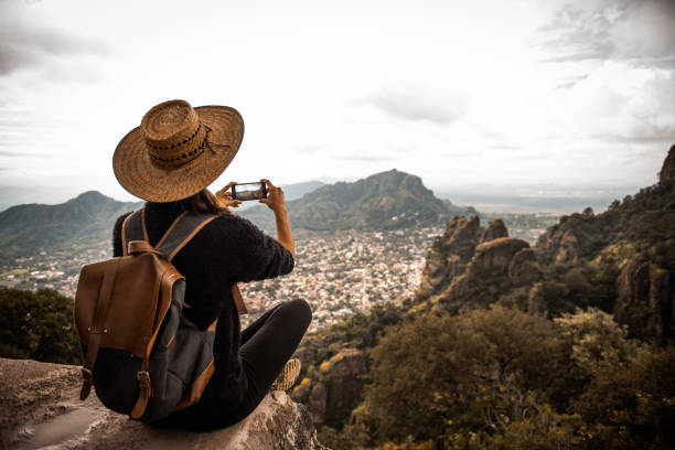 istock Tourist woman making a photo. 1069735968