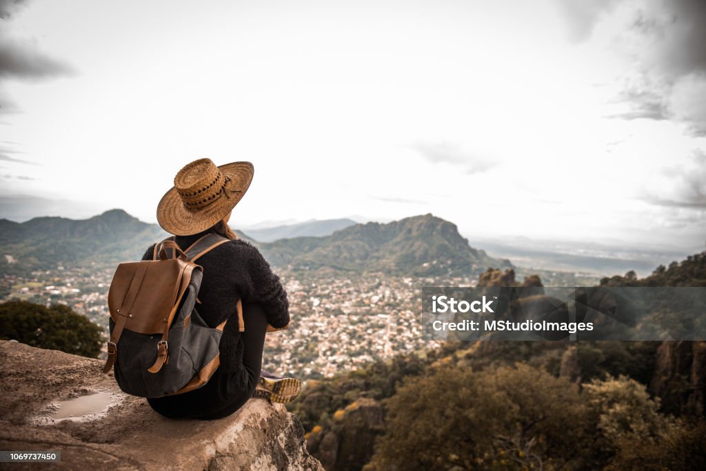 Woman enjoing the view. Argentinian woman traveling Mexico. She is enjoying the view on Tepoztlan, Mexico Travel Stock Photo