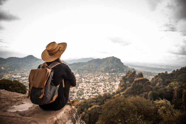 Woman enjoing the view. Argentinian woman traveling Mexico. She is enjoying the view on Tepoztlan, Mexico mountain peak photos stock pictures, royalty-free photos & images