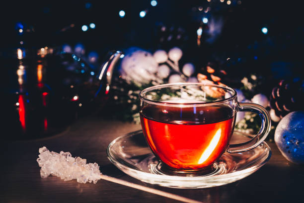 istock Glass cup of tea at dark room 1069739440