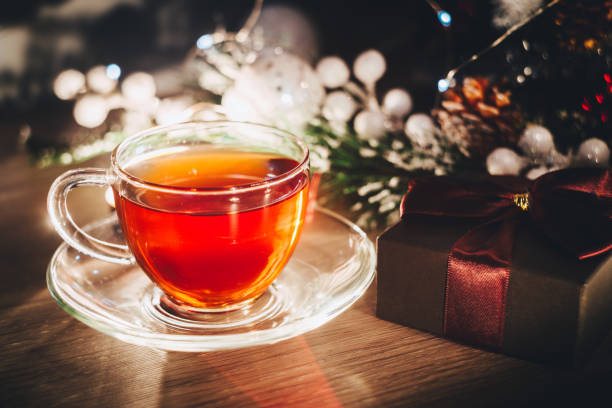 istock Cup of tea and box with present 1069739676