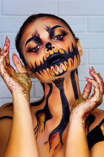 istock Makeup for Halloween for brunettes, makeup pumpkin. 1069743220