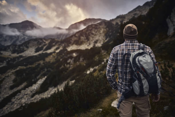 Traveling alone in the mountains at sunset. Getting away from it all
