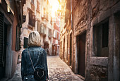 Tourist exploring old streets of Croatia city - Rovinj