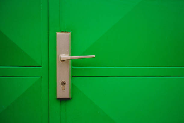 istock Metal handle on a green garage door 1069750562
