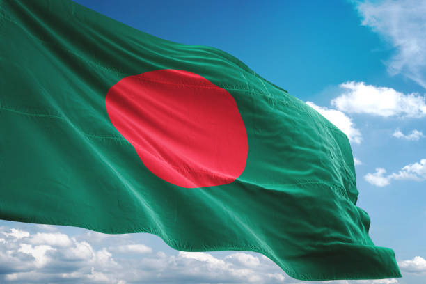 istock Bangladesh flag waving cloudy sky background 1069750622