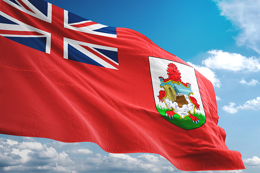 Bermuda flag waving cloudy sky background realistic 3d illustration