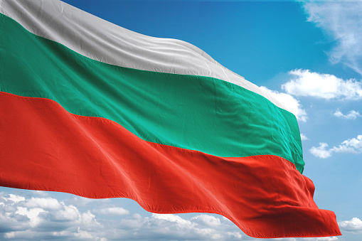 Bulgaria flag waving cloudy sky background realistic 3d illustration
