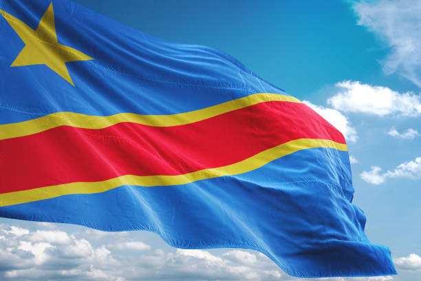 istock Congo The Democratic Republic flag waving cloudy sky background 1069751924