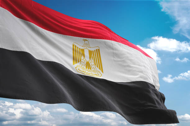 Egypt flag waving cloudy sky background Egypt flag waving cloudy sky background realistic 3d illustration egyptian flag stock pictures, royalty-free photos & images