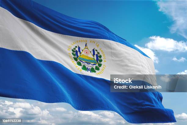 El Salvador Flag Waving Cloudy Sky Background Stock Photo - Download Image Now - El Salvadoran Flag, El Salvador, Flag