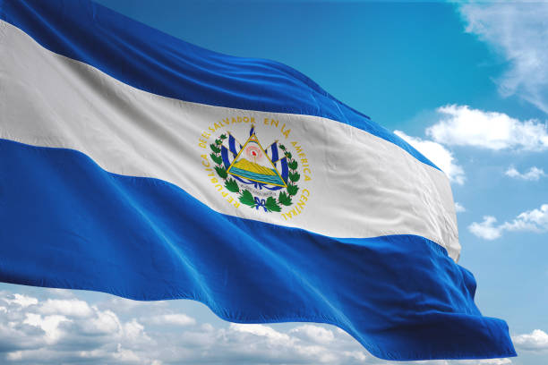 el salvador flag waving cloudy sky background - salvadoran flag imagens e fotografias de stock