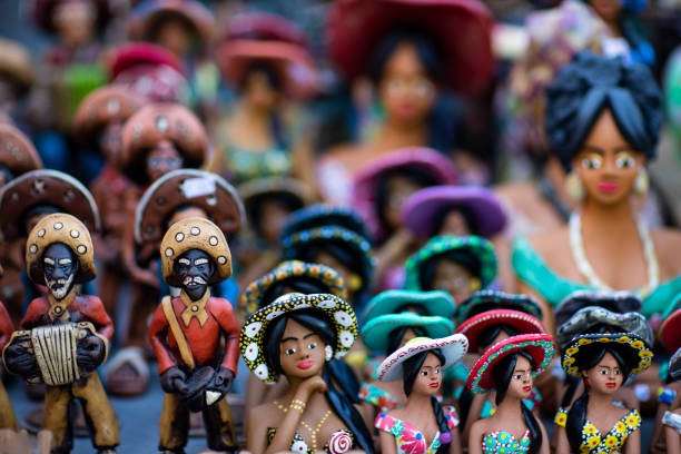 Clay dolls. Clay dolls from Brazil. Concept of musicians and women. stock photo
