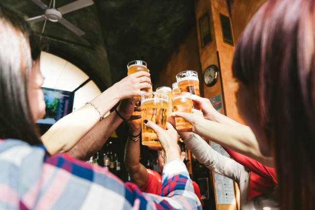 istock Group of happy friends drinking beer at the brewery 1069753468