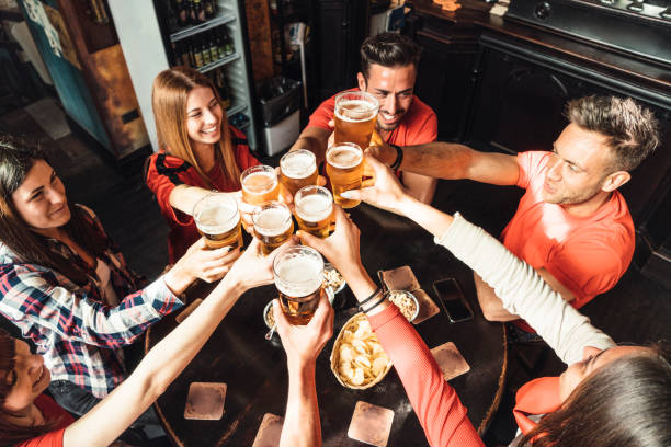istock Group of happy friends drinking beer at the brewery 1069753492