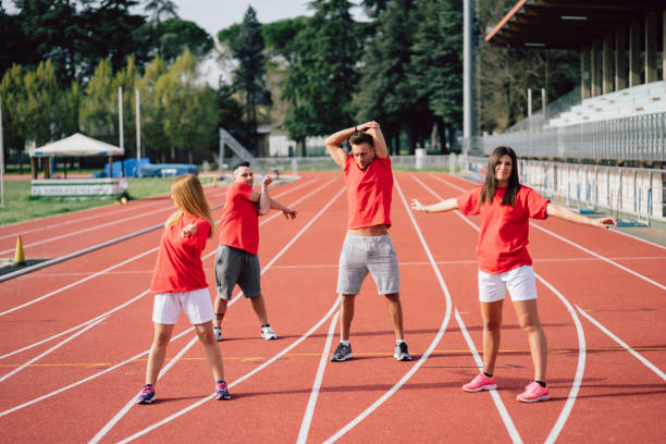 istock Group of runners warming up on race track 1069753596