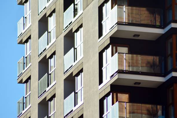 istock Fragment of a facade of a building with windows and balconies. 1069753992