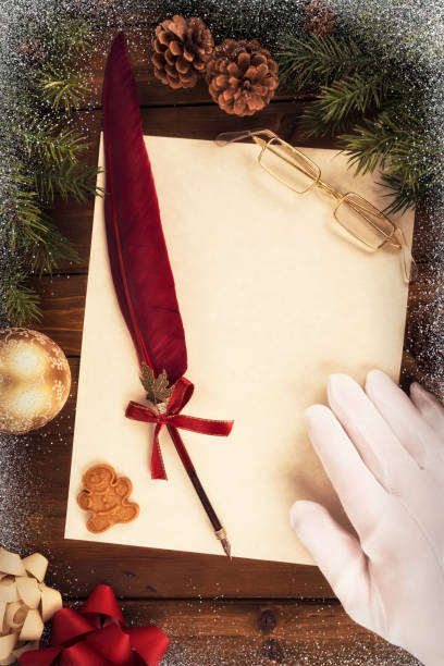 istock Santa Claus writing a letter, directly above. 1069754004