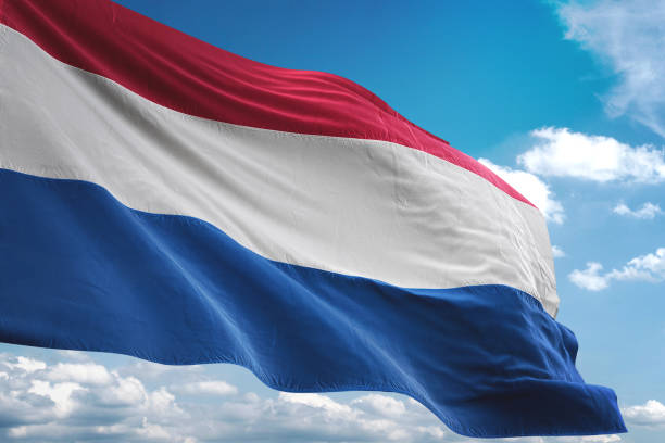 istock Netherlands Holland flag waving cloudy sky background 1069756602