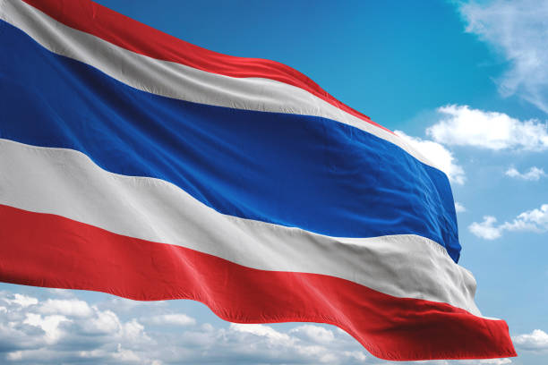 Thailand flag waving cloudy sky background Thailand flag waving cloudy sky background realistic 3d illustration thai flag stock pictures, royalty-free photos & images