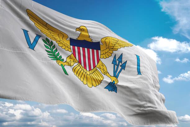 istock Virgin Islands US flag waving cloudy sky background 1069758180