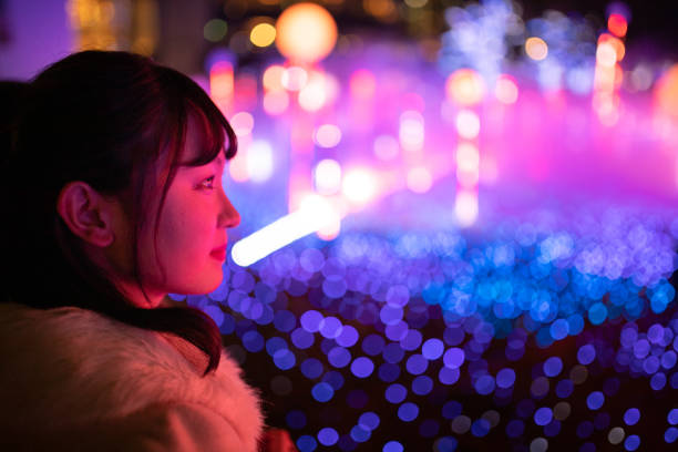 Young woman watching Christmas illumination