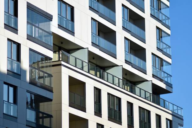 istock Fragment of a facade of a building with windows and balconies. 1069763376