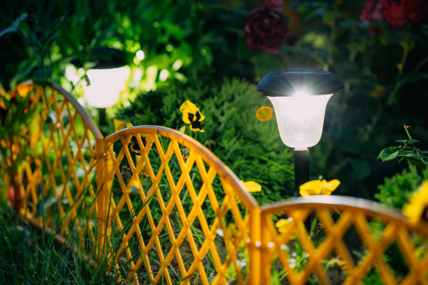 istock Solar Garden Light, Small Decorative Lanterns In Flower-Bed. Garden Design. Solar Powered Lamp 1069764360