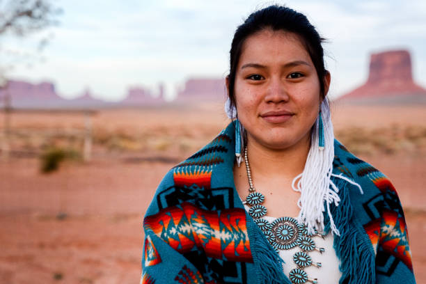 Navajo Native American Teenage Girl Outdoor Portrait Pretty and Cheerful Native American Indian Teenage girl in an outdoor closeup environmental portrait indigenous north american culture photos stock pictures, royalty-free photos & images