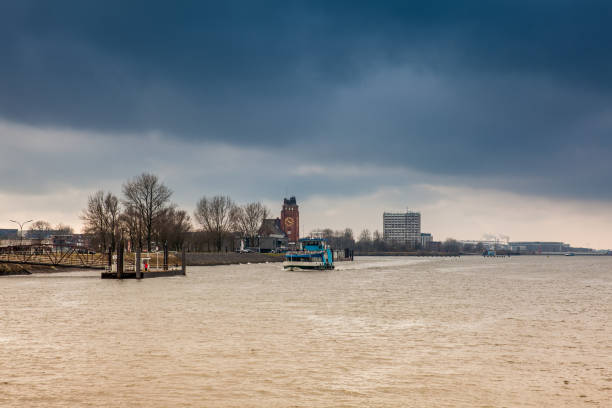 istock Ferry navigating on the Elbe river in a cold cloudy winter day in Hamburg 1069769072
