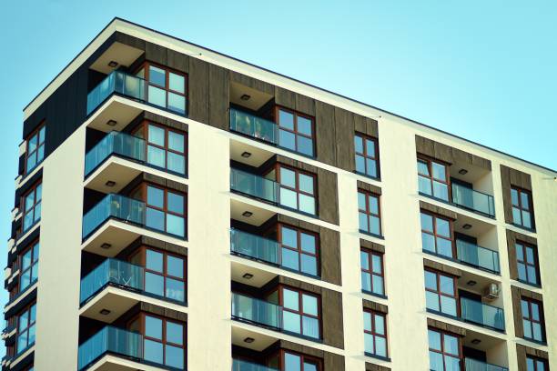 istock Fragment of a facade of a building with windows and balconies. 1069774838