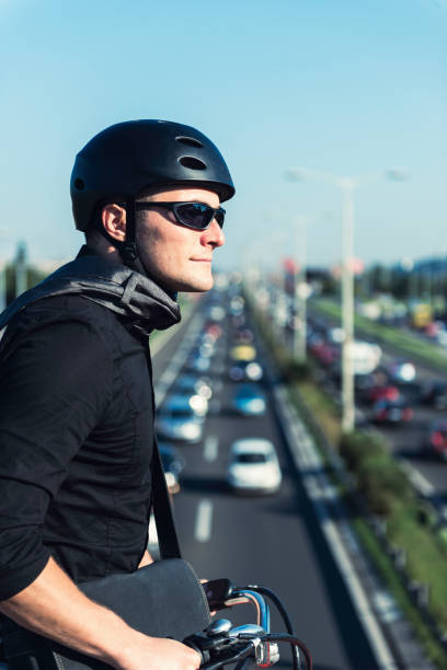 istock Businessman Riding Bicycle In City 1069775724