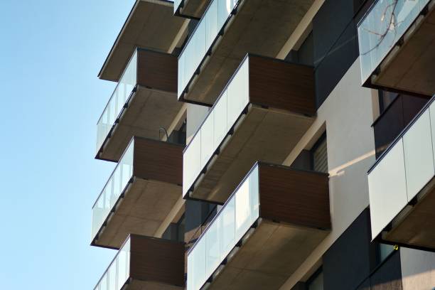 istock Fragment of a facade of a building with windows and balconies. 1069781796