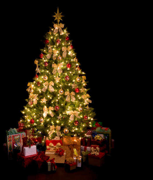 istock Christmas Tree with Nativity Ornaments on a Black Background 1069783430