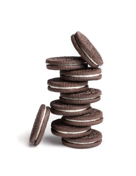 istock Cookie and cream chocolate cookies in stack and single pieces on white background, food concept 1069785394