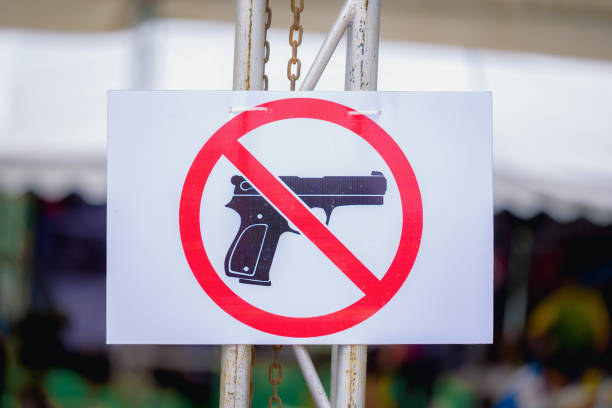 Close-Up Of Gun Free Zone Sign  gun free zone sign stock pictures, royalty-free photos & images