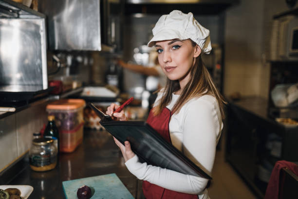 istock Woman working in the restaurant and making daily food menu 1069790224