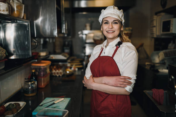 istock Portrait of a female chef working in the restaurant kitchen 1069790660