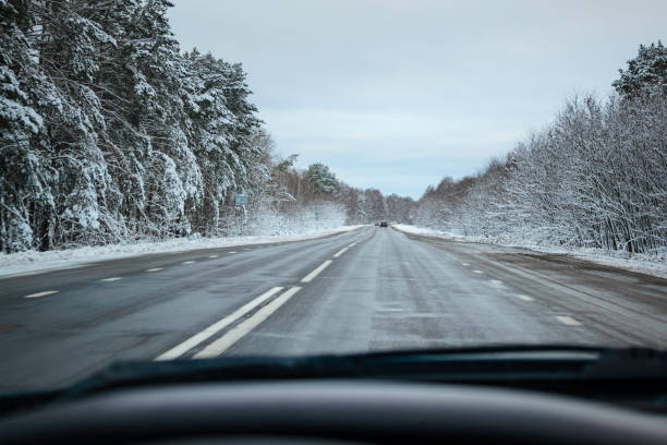 istock Winter snowy road from the car window. 1069790710