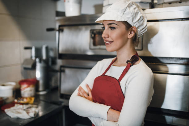 istock Portrait of a female chef working in the restaurant kitchen 1069790750