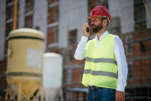 istock Young male engineer with walkie-talkie 1069793656