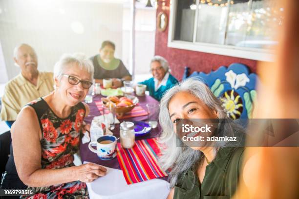 Mexican Family Takes A Selfie At Dinner Stock Photo - Download Image Now - Senior Adult, Party - Social Event, Family