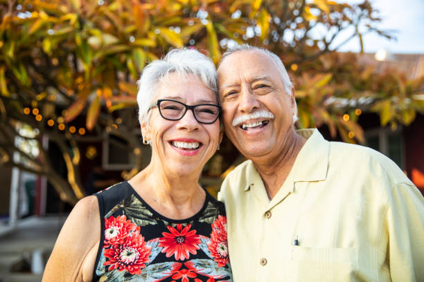 istock Cute Senior Mexican Couple Taking Photos Together 1069798566