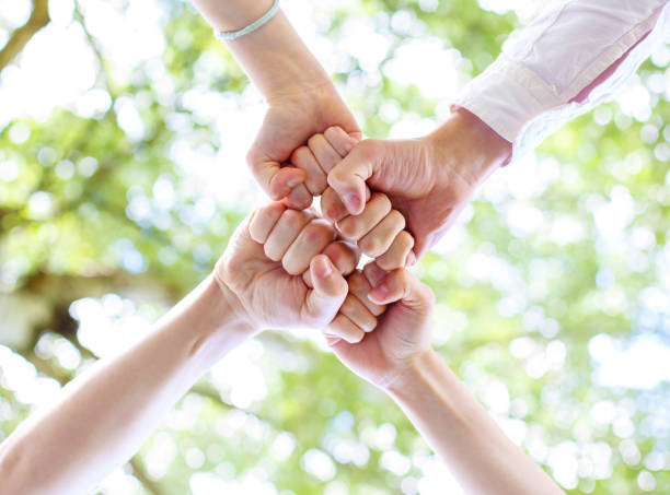 istock Teenagers joined their hands in a circle 1069800102