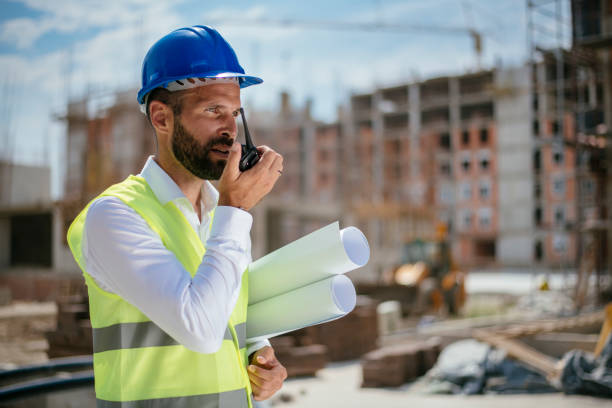 istock Young male engineer with walkie-talkie 1069800158