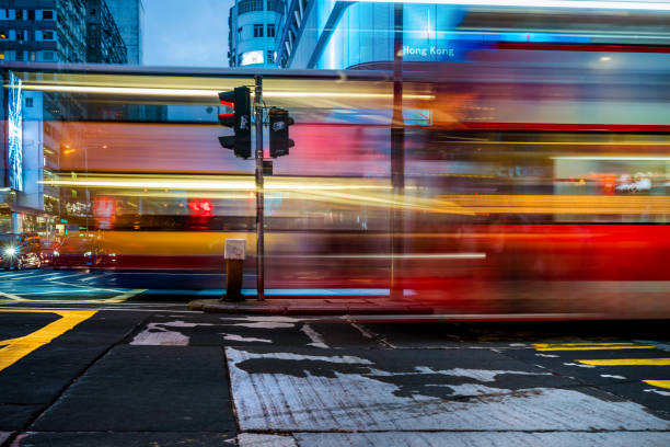 istock Moving bus rushing trough Hongkong Nathan Road 1069800610